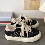 Black Canvas Sneakers with Stitched Flower Design - Image 3